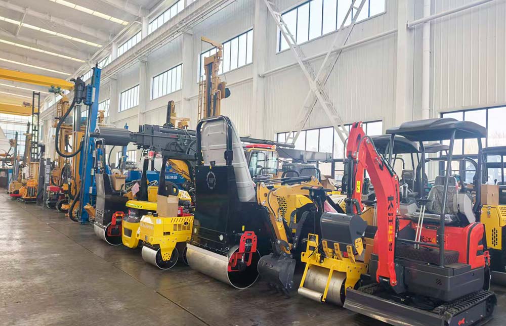 Compact construction machines arranged inside a workshop